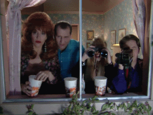 Animated gif of Married With Children cast eating popcorn and looking out a window with binoculars